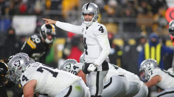 Las Vegas Raiders Derek Carr (4) points to Pittsburgh Steelers safety Minkah Fitzpatrick during the first half at Acrisure Stadium in Pittsburgh, PA on December 24, 2022.